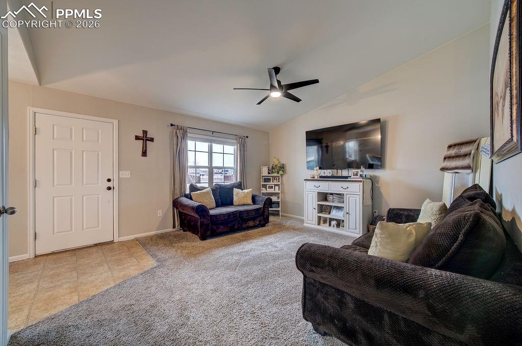 Image 6 of 48: Vinyl front entry into the Living Room with large view window to the front