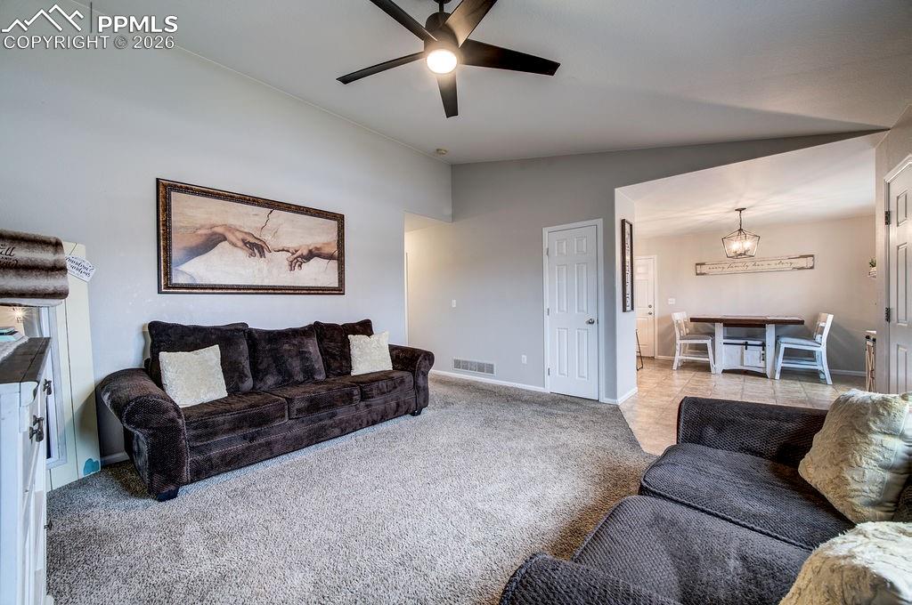 Image 8 of 48: Living Room into the Dining Area and Kitchen.