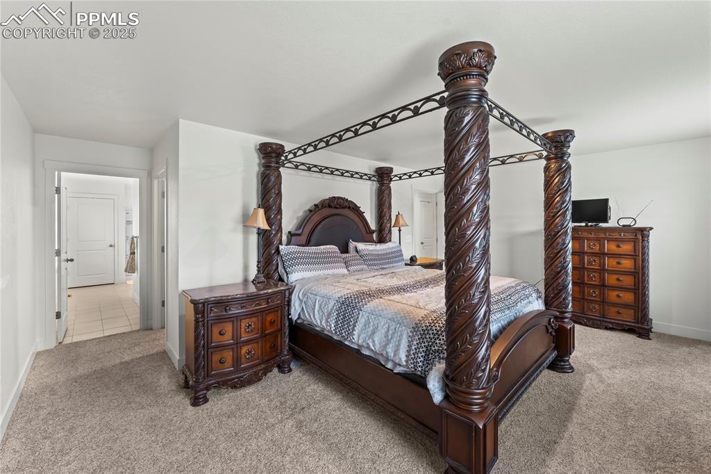 Image 29 of 39: Bedroom featuring baseboards and carpet flooring