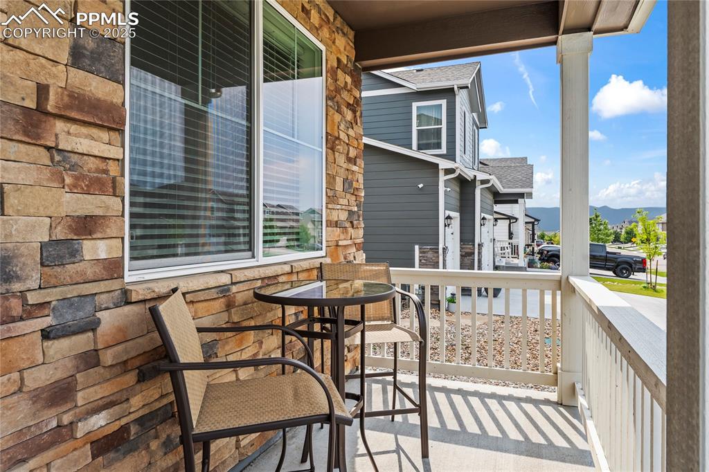 Image 3 of 39: Covered porch with a mountain view