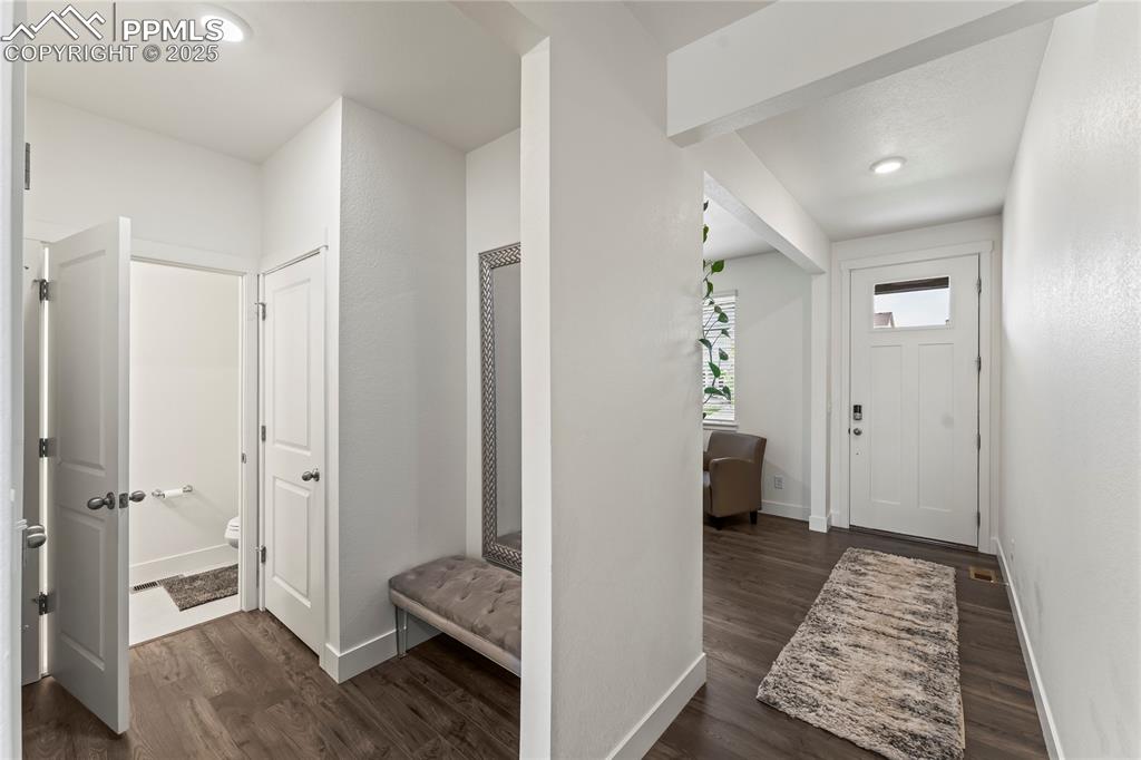 Image 7 of 39: Mudroom featuring dark wood-style flooring and recessed lighting