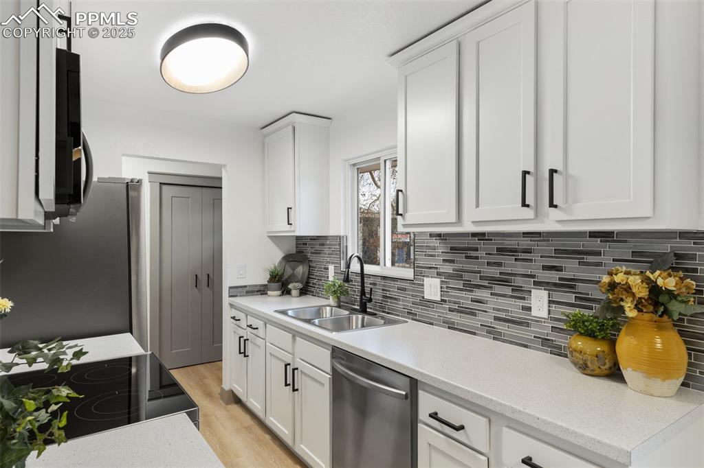 Image 13 of 36: Contemporary kitchen with polished upgrades.