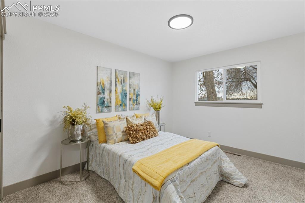 Image 17 of 36: Serene primary retreat with soft natural light.