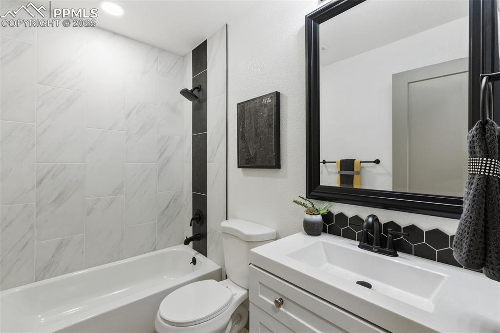 Image 19 of 36: Modern bathroom with designer finishes.