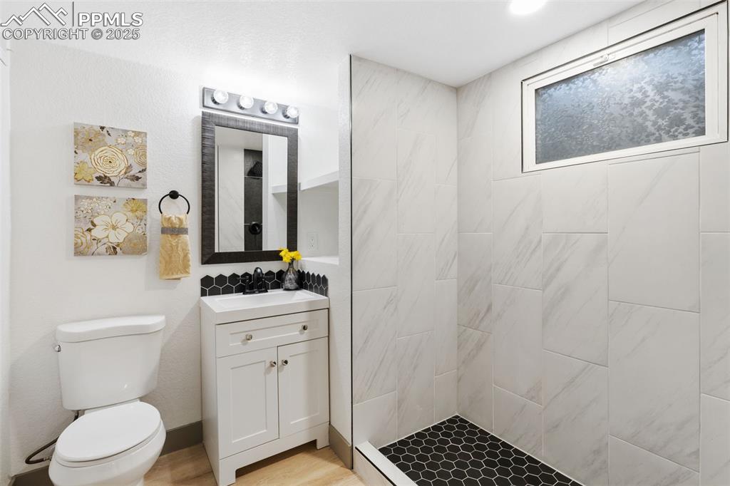 Image 24 of 36: Modern bathroom with designer finishes.