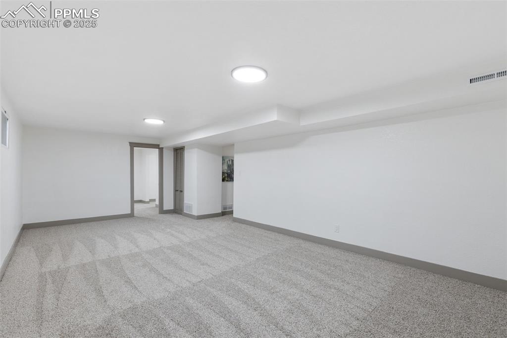 Image 27 of 36: Huge finished basement for endless possibilities.