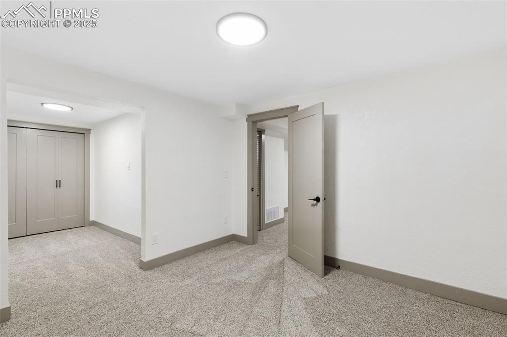 Image 29 of 36: Cozy adjoining nook perfect for lounging or dressing.