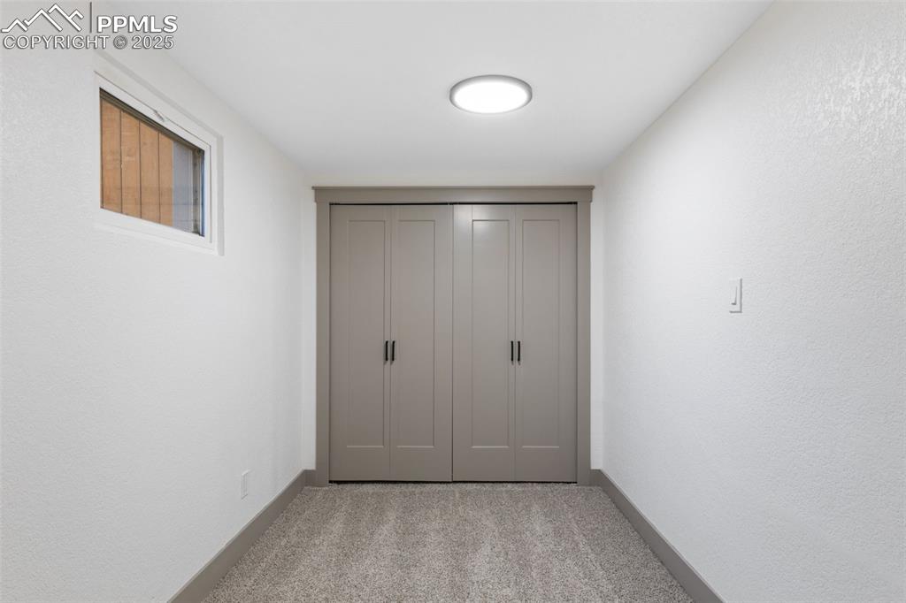 Image 30 of 36: Bonus bedroom space with natural light.