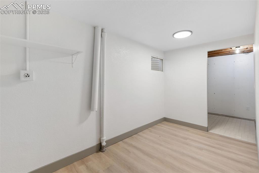 Image 31 of 36: Laundry room with extra storage space.