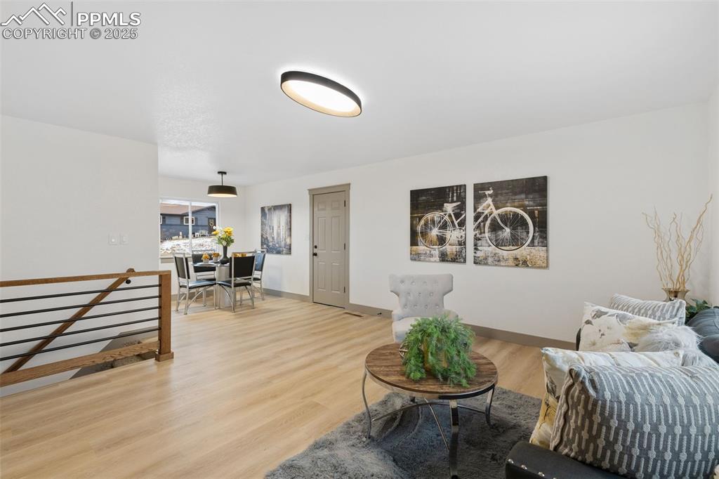 Image 7 of 36: Warm, spacious living area flow.