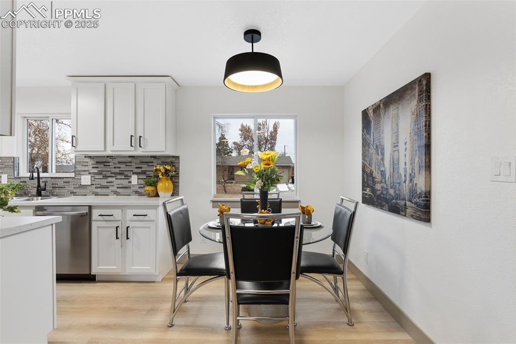 Image 9 of 36: Bright dining space with views.