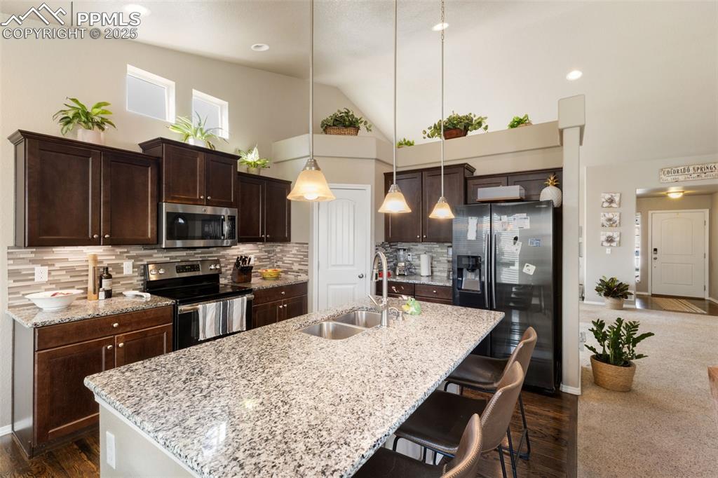 Image 13 of 43: Granite Counters and center island 