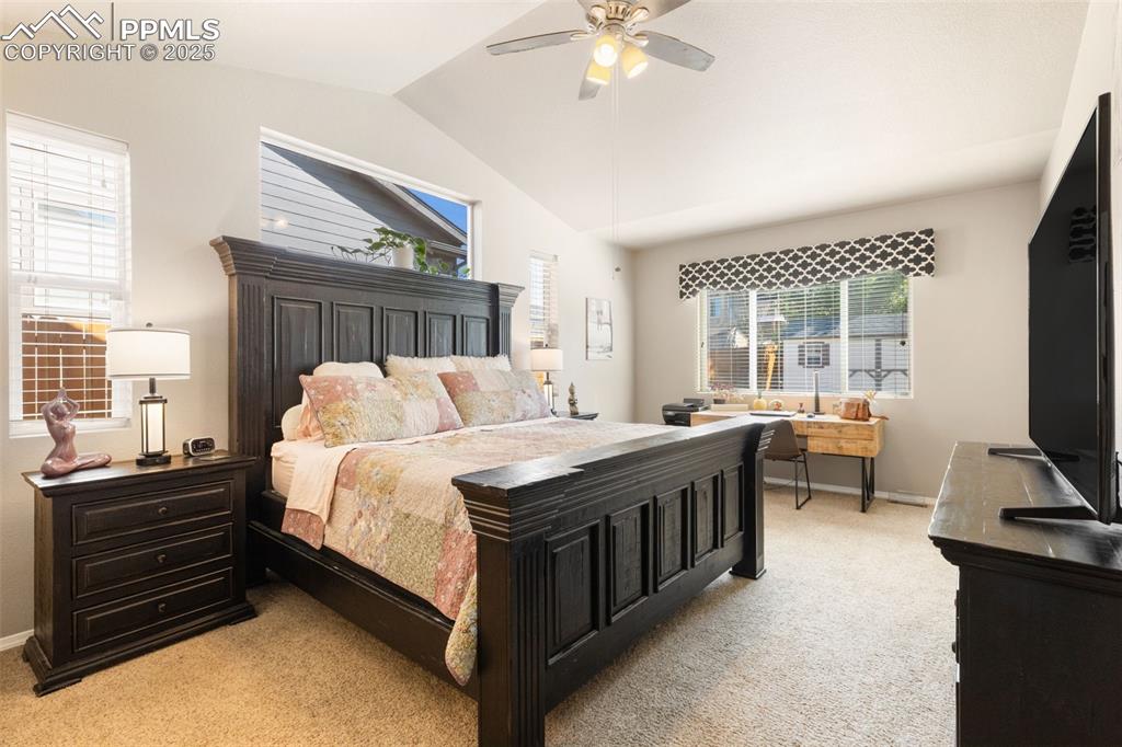 Image 18 of 43: The spacious Primary Bedroom has vaulted ceilings