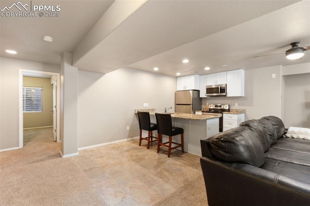 Image 25 of 43: The Basement has its own full Kitchen