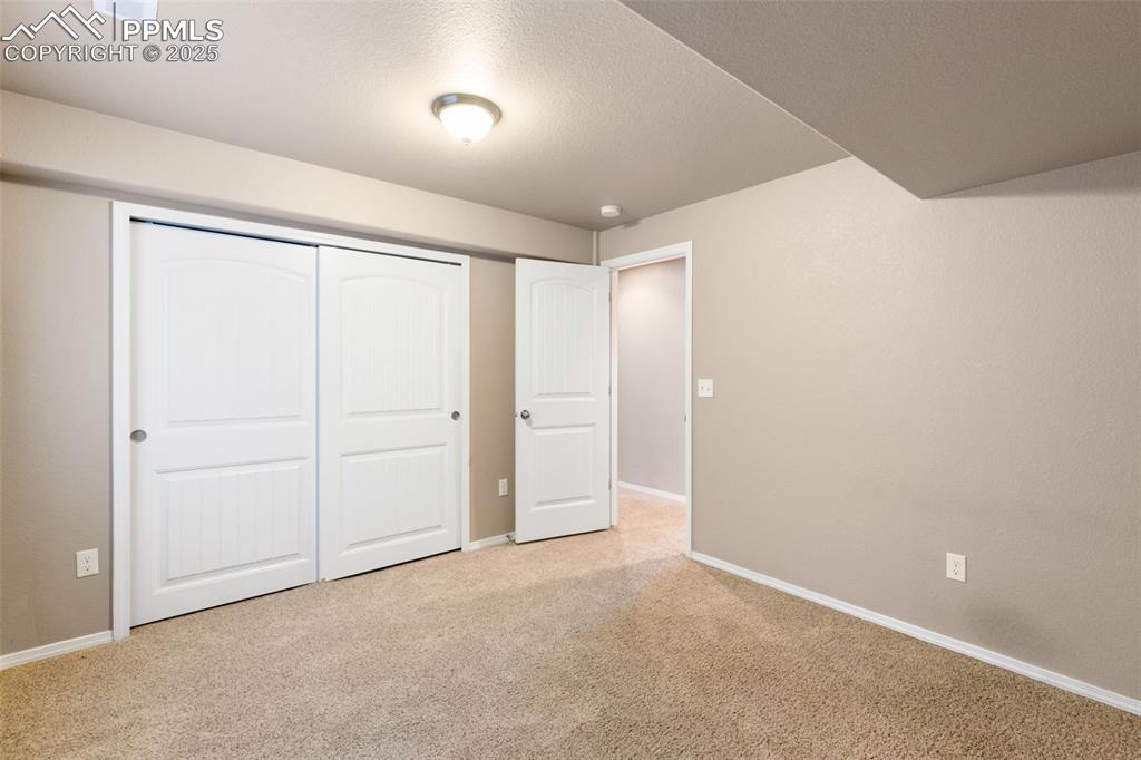 Image 32 of 43: Basement Bedroom