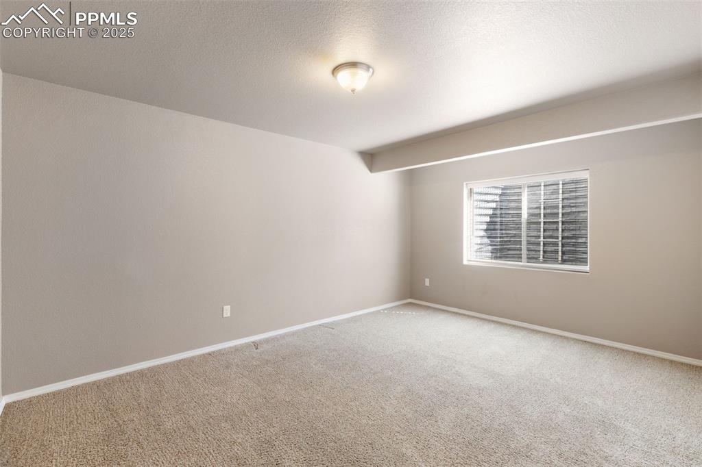 Image 34 of 43: Basement Bedroom