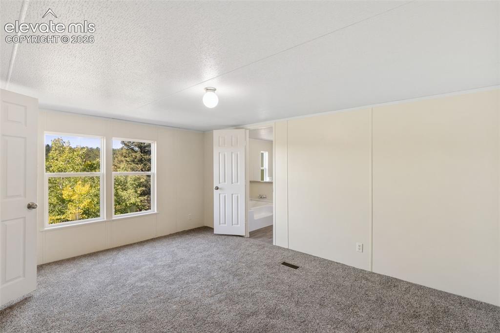 Image 13 of 28: Master Bedroom