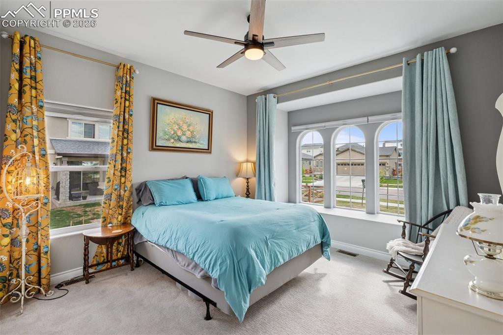 Image 30 of 46: Carpeted bedroom featuring baseboards and a ceiling fan