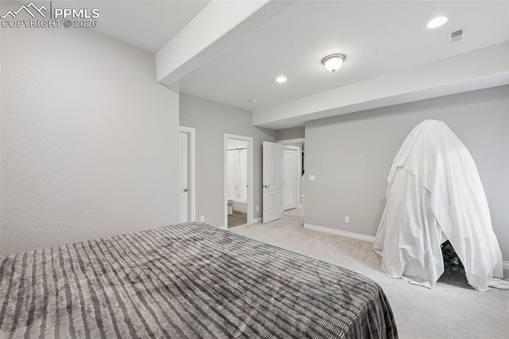 Image 40 of 46: Junior suite with carpet, baseboards, recessed lighting, and ensuite bathro