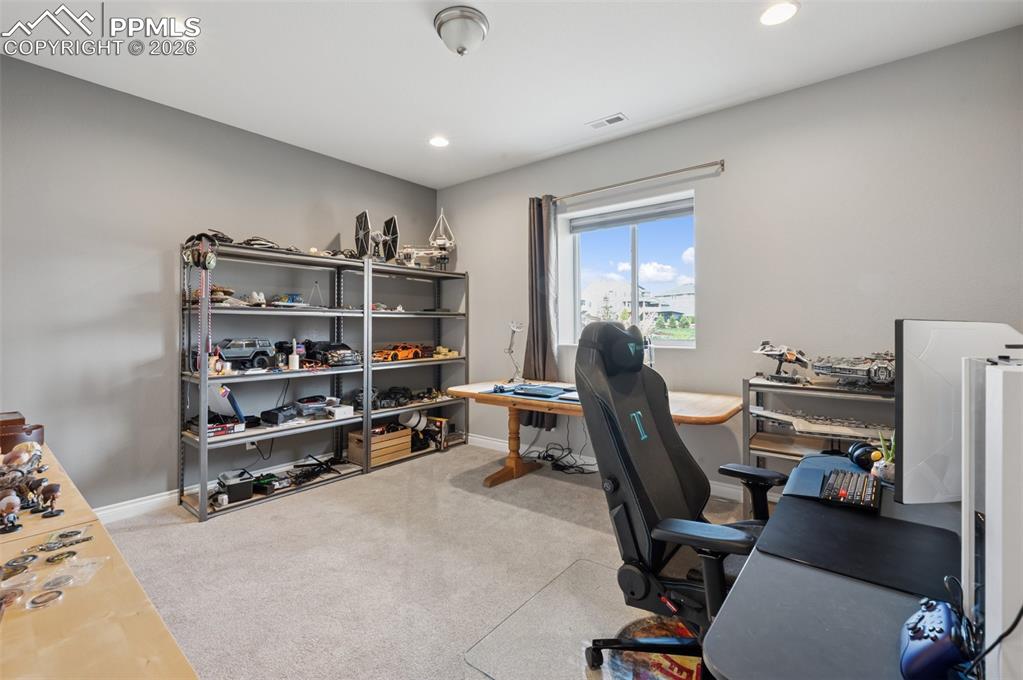 Image 41 of 46: Bedroom with carpet flooring, recessed lighting, and baseboards