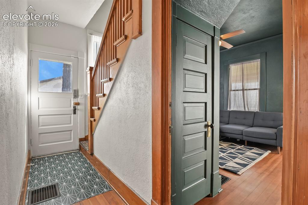 Image 15 of 36: Easy conversion back to a two-unit configuration by adding a wall at the st