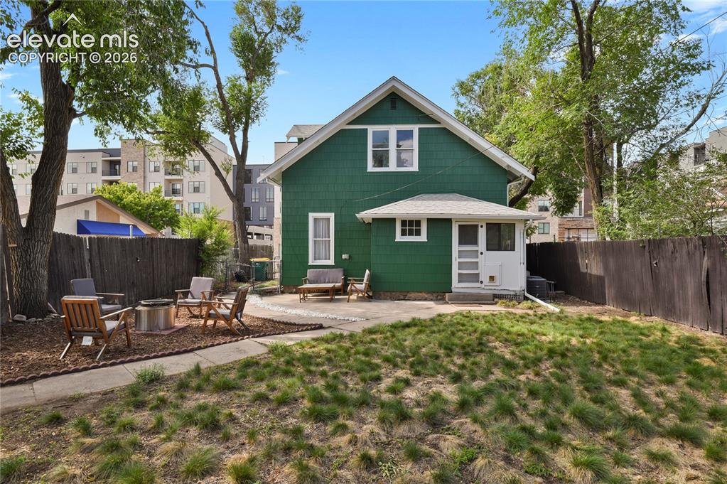 Image 2 of 36: Spacious backyard with drought-resistant grass