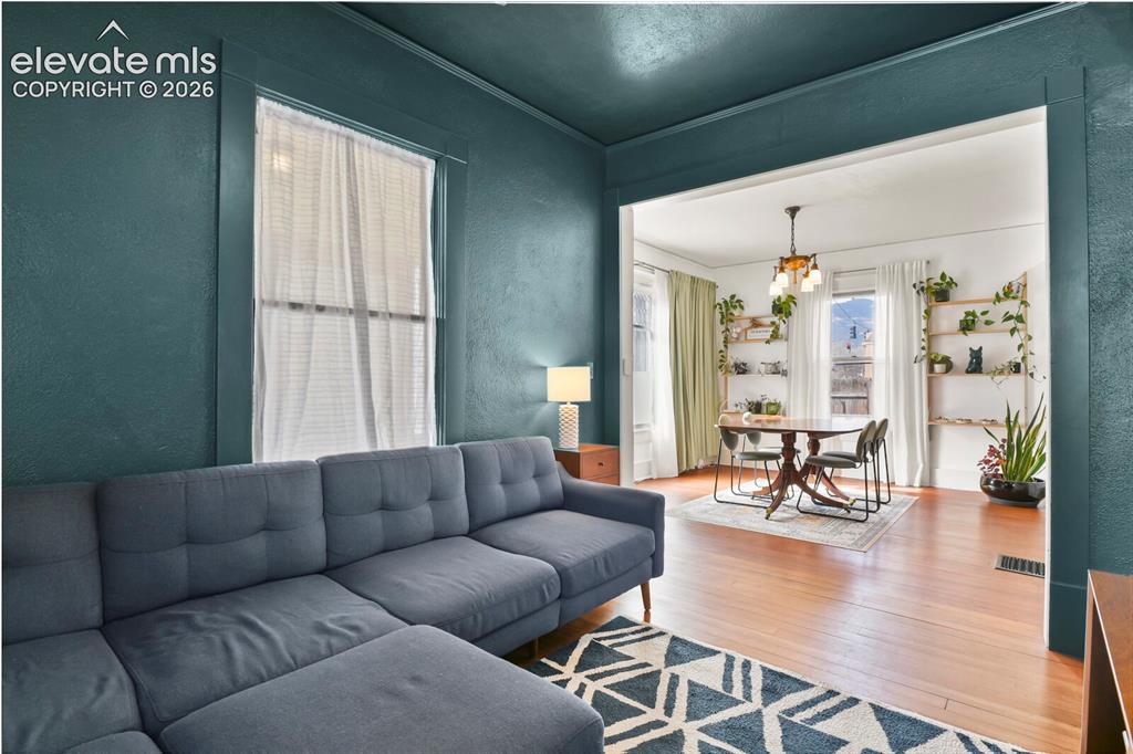 Image 4 of 36: Beautiful hardwood flooring runs through much of the home