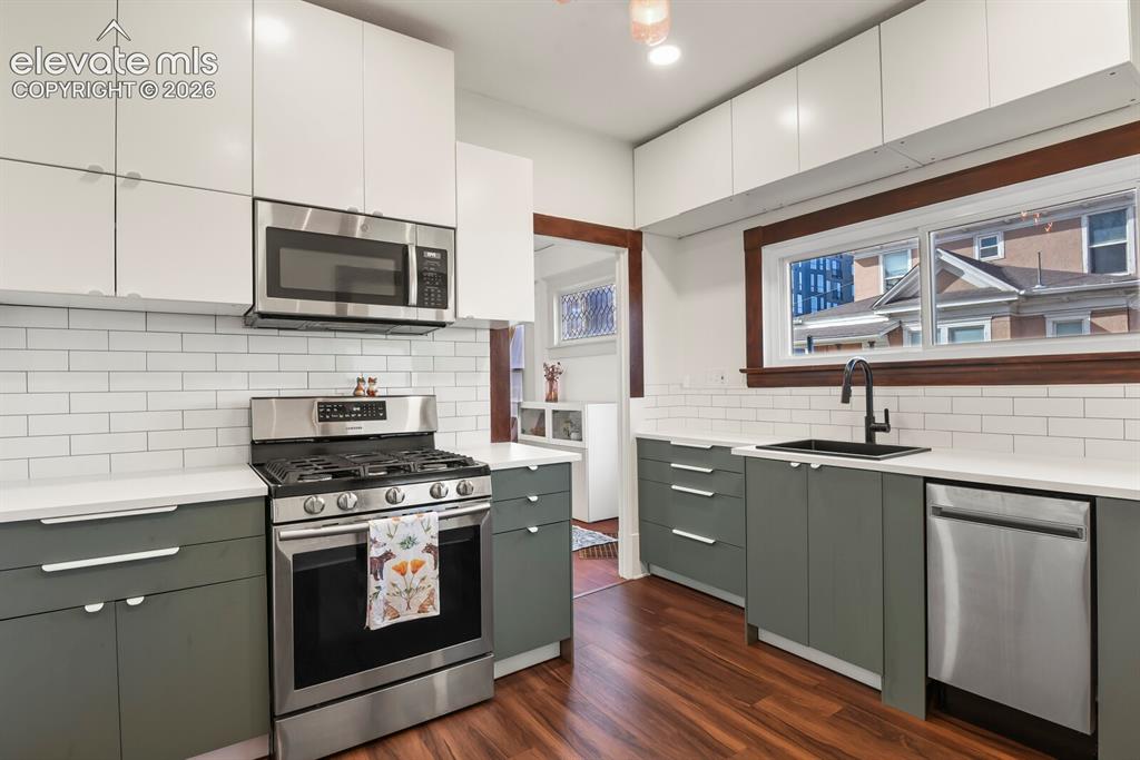 Image 5 of 36: Updated kitchen showcases sleek modern cabinetry, fresh paint, and stainles