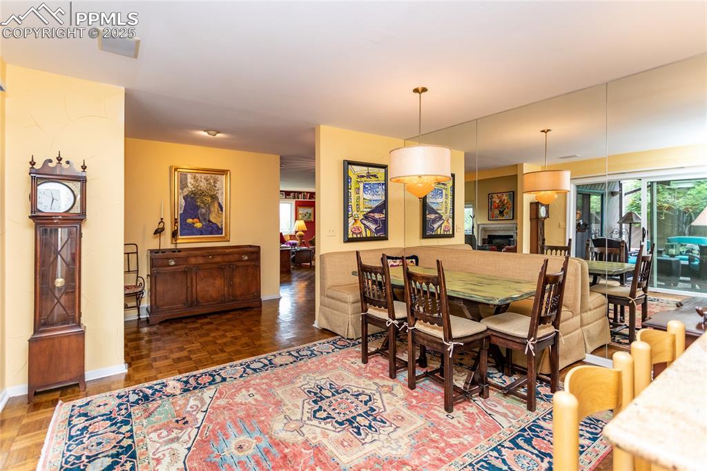 Image 32 of 46: Dining space featuring plenty of natural light and a fireplace