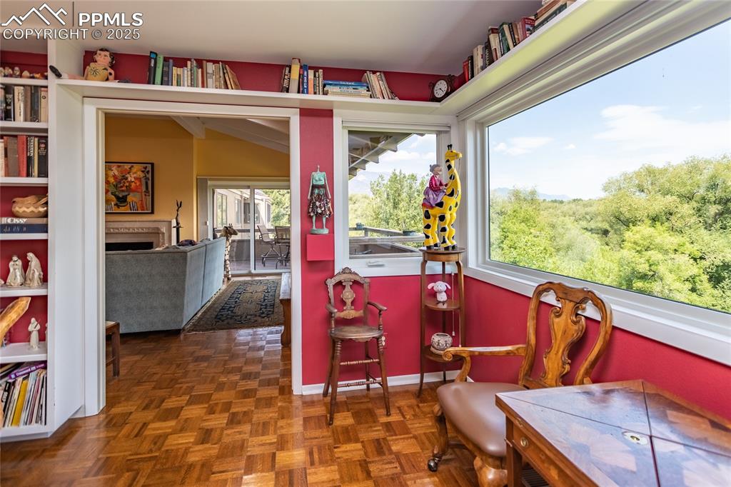Image 9 of 46: Sitting room with a fireplace