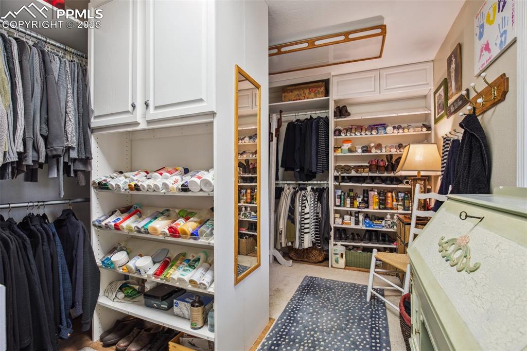 Image 20 of 43: Huge closet with lots of built ins
