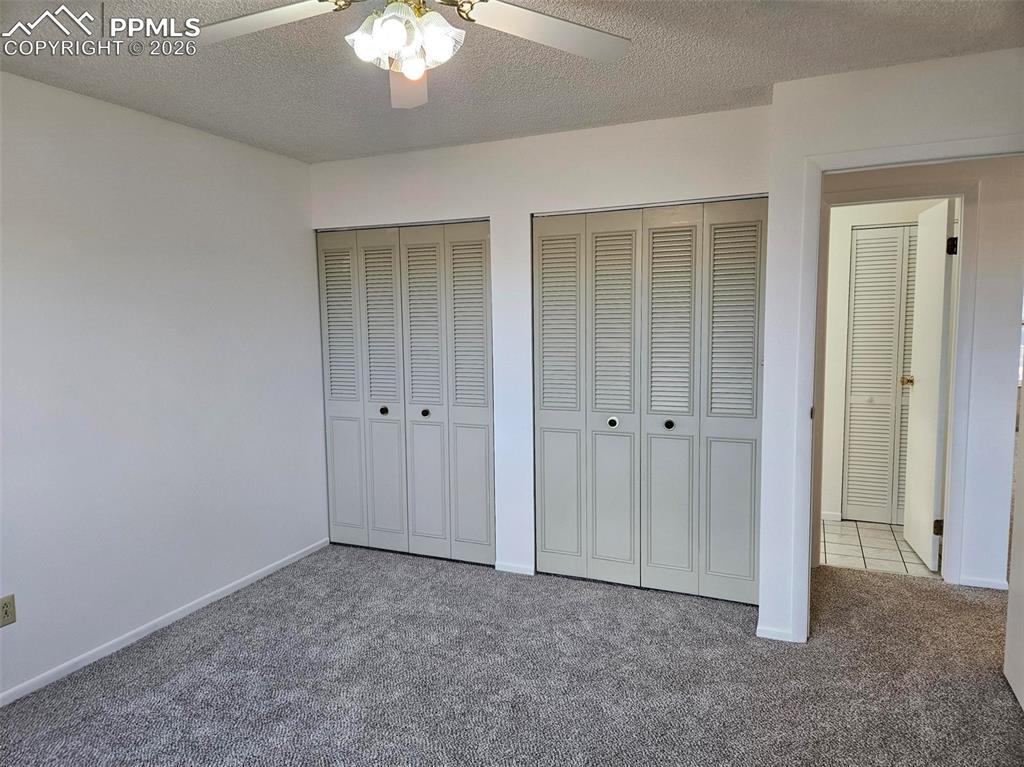 Image 14 of 35: Upper primary bedroom-double closets