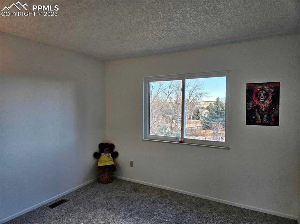 Image 15 of 35: Upper bedroom