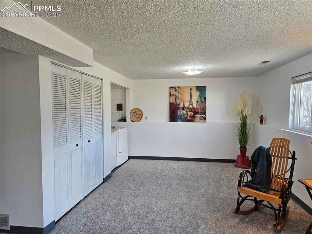 Image 19 of 35: Lower level family room