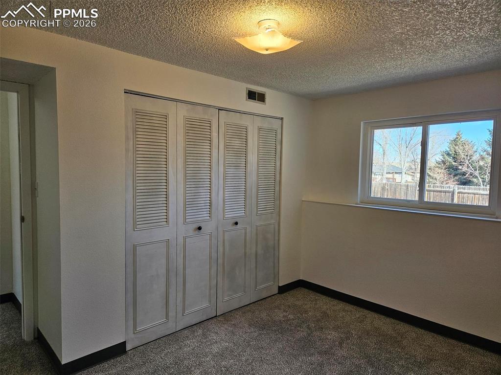 Image 23 of 35: Lower level bedroom closet