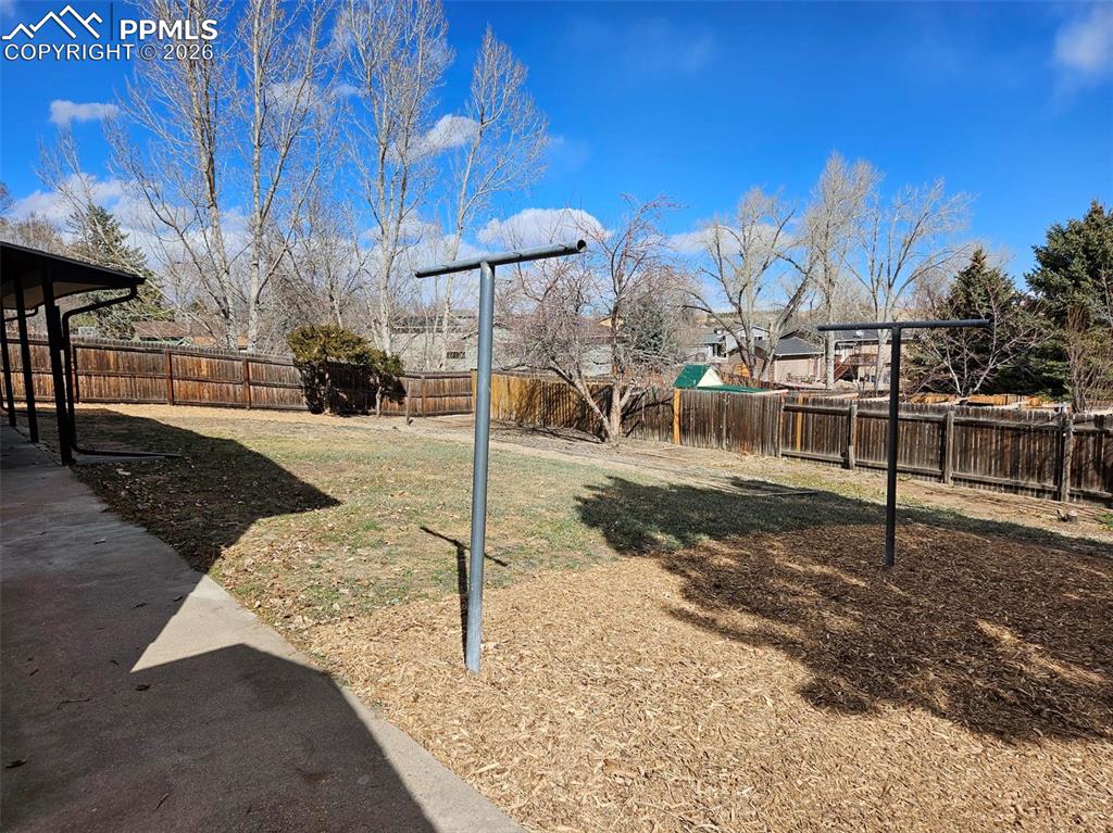 Image 31 of 35: View of fenced backyard