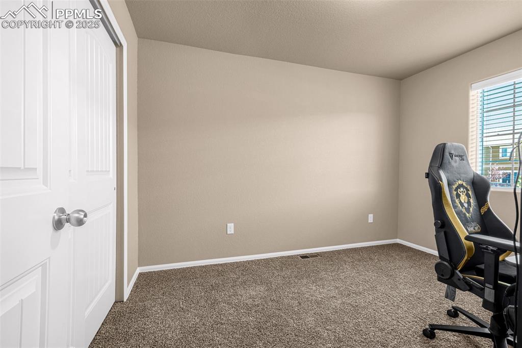 Image 15 of 19: Third bedroom upstairs