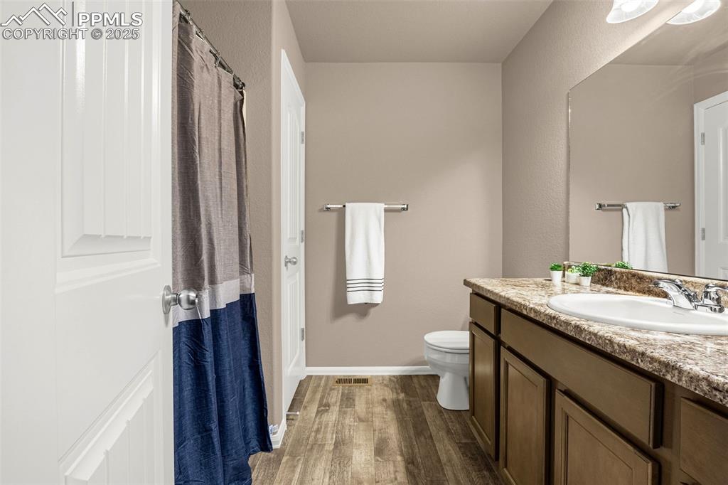 Image 16 of 19: Third bathroom upstairs with tub/shower combo