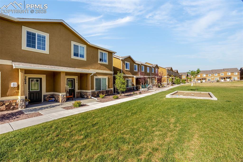 Image 2 of 19: HOA maintained spacious lawn ready for summer!
