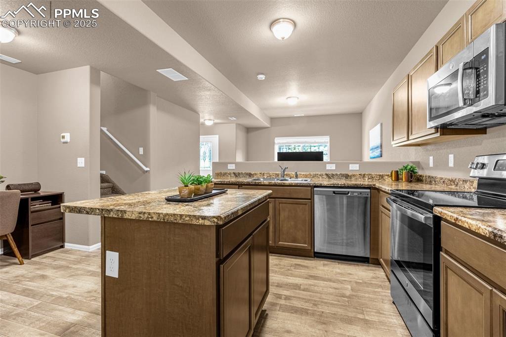 Image 7 of 19: All of the storage needed and open to living room so you never miss any of