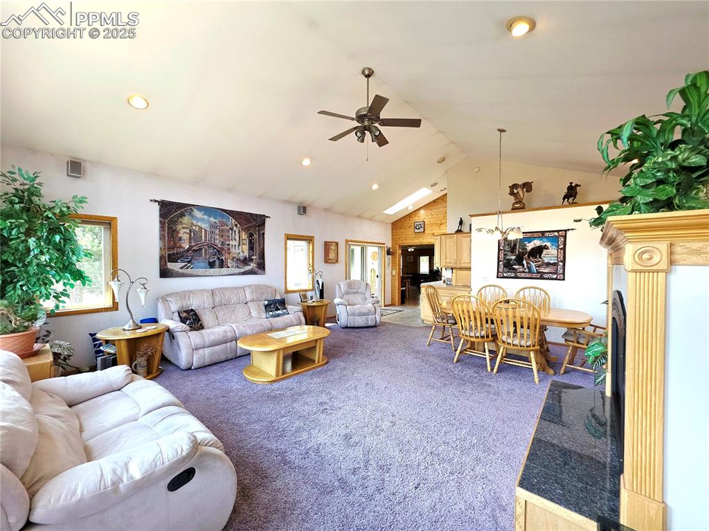 Image 17 of 50: Fabulous great room has wet bar, gas log fireplace with auto thermostat for