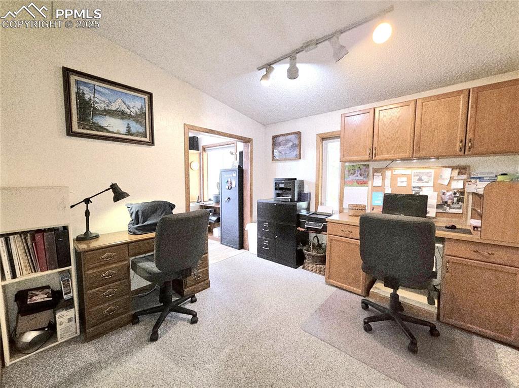 Image 26 of 50: Currently being used as an office, leads to 2nd great room. Could easily be