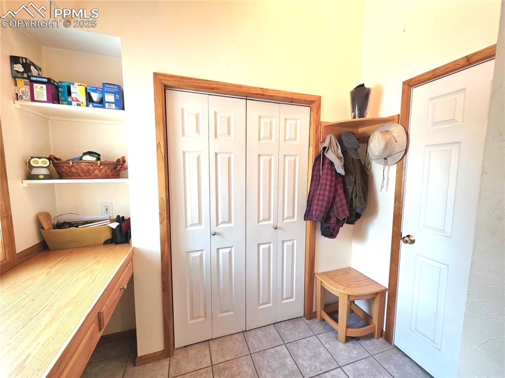 Image 30 of 50: just off of side entry, spacious additional double door pantry storage and 