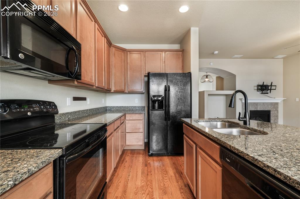 Image 23 of 50: Kitchen with granite countertops, large island, additional breakfast eat in