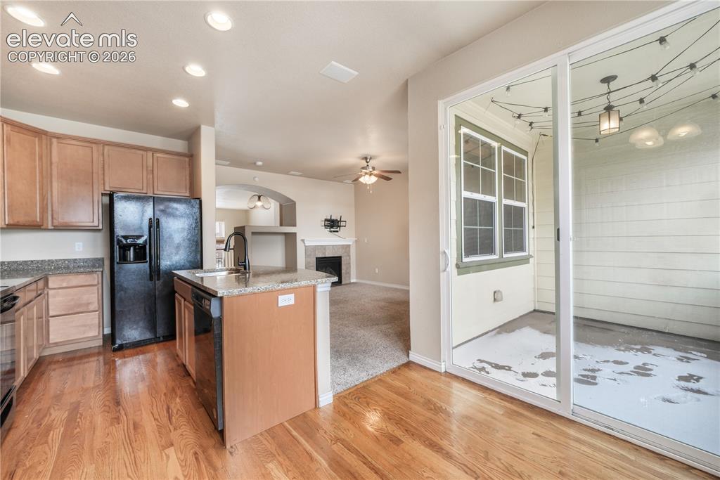Image 25 of 50: Kitchen with granite countertops, large island, additional breakfast eat in