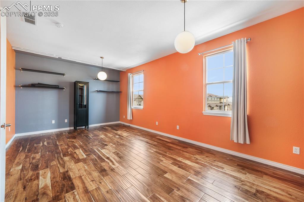 Image 29 of 50: Large bedroom with ensuite bathroom