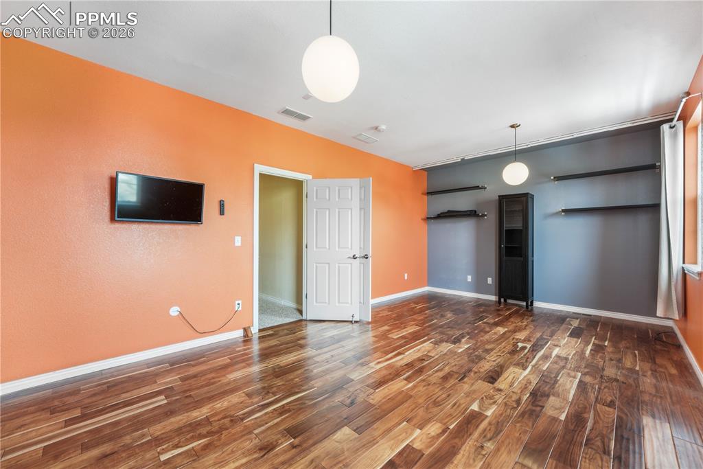 Image 30 of 50: Large bedroom with ensuite bathroom