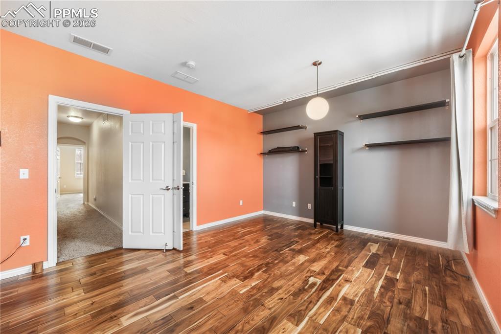 Image 31 of 50: Large bedroom with ensuite bathroom