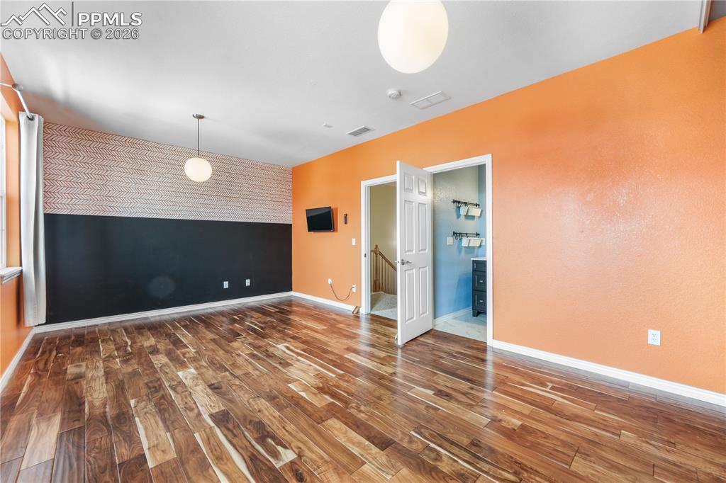 Image 32 of 50: Large bedroom with ensuite bathroom