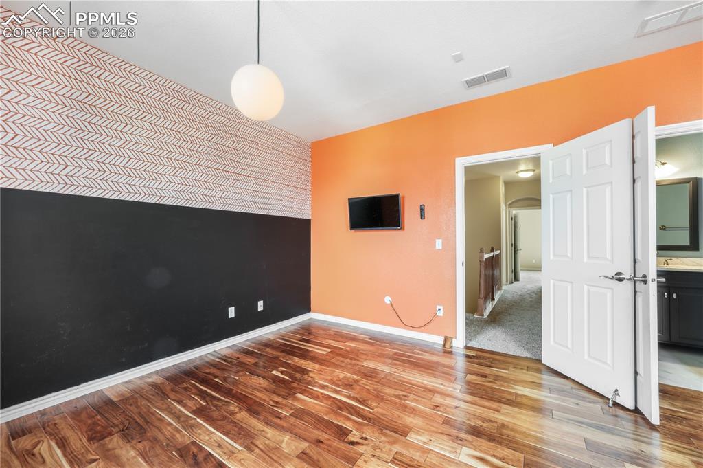 Image 33 of 50: Large bedroom with ensuite bathroom